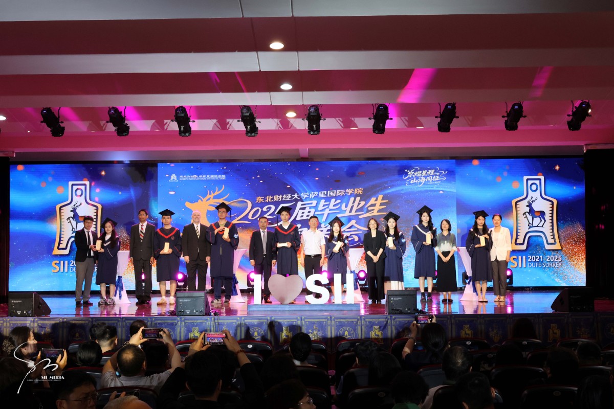 Students on platform at SII-DUFE graduation ceremony, June 2025.jpg