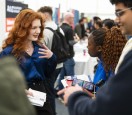 Careers fair chatting woman and students