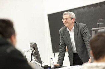 A speaker addresses a conference workshop