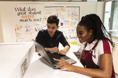Two students working in MySurrey Hive.