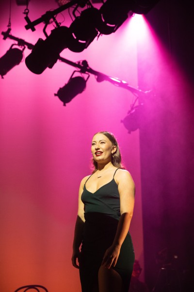 Production still of female performer in 'Beginners Please!', performance by GSA Cert HE Foundation studentsproduction