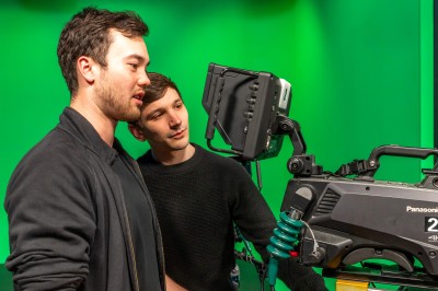 University of Surrey FBPE students with cameras against a green screen