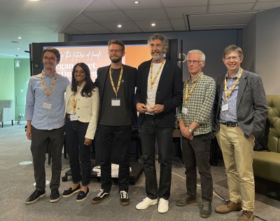Speakers from left to right at plant-based tasting event held at University of Surrey: Nikita Bilousov, Co-Founder, Delishh!, Indy Kaur, CEO and Founder, Plant Futures Collective, Linus Pardoe, Senior UK Policy Manager, Good Food Institute, Richard Fox, Founder, Cock and Bull, Alistair Currie, Policy and Public Affairs Manager, The Vegan Society, Professor Andrew Godley, Sussex Business School