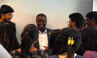 Royal Brunei Airlines speaker Adiel Mambara surrounded by University of Surrey masters students