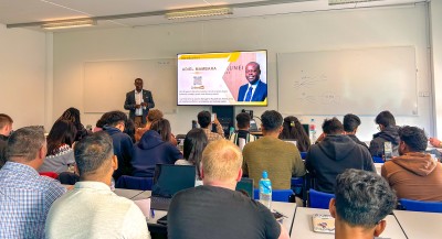 Guest speaker Adiel Mambara of Royal Brunei Airlines speaks to masters students at the University of Surrey