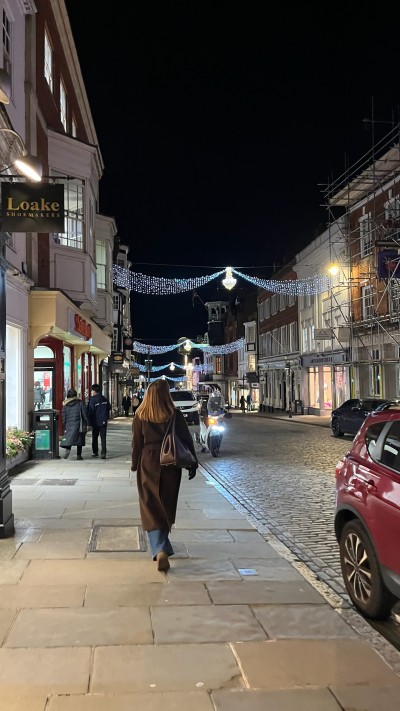University of Surrey modern languages BSc student, Amelia, walking in Guildford High Street at night