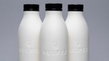 Three Pulpex paper fibre bottles displayed on a grey background