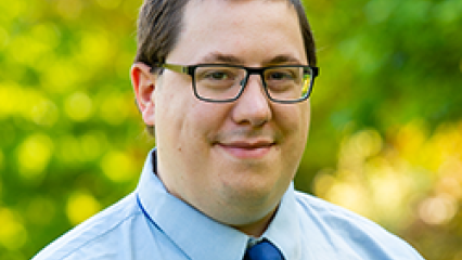 Dr Simon Hadfield, head and shoulders against outdoor greenery