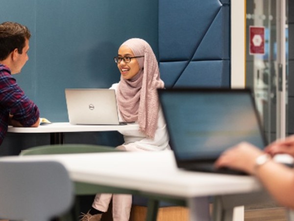 Students study on laptops