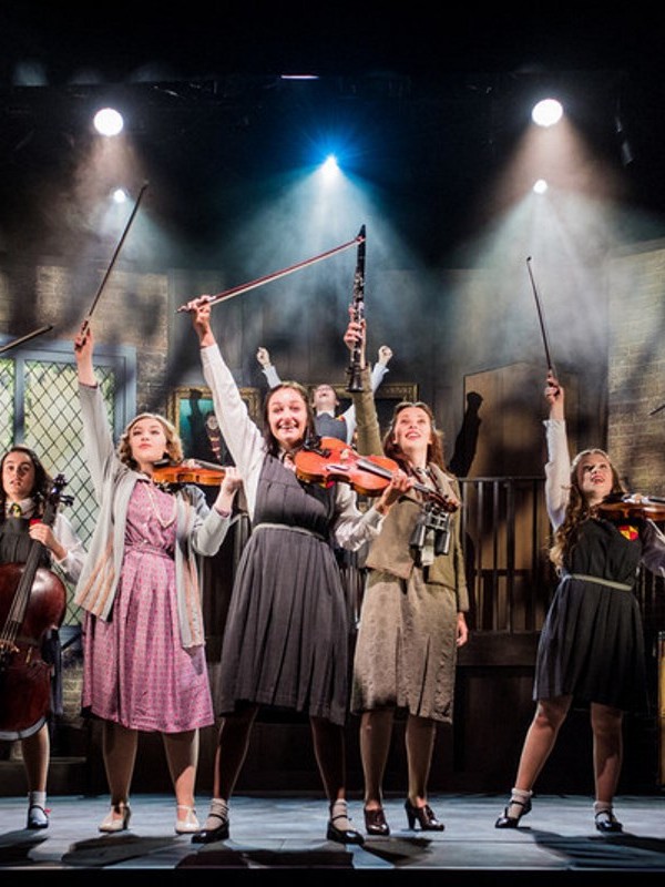 Students performing on stage