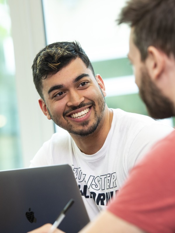 Smiling postgraduate male students 