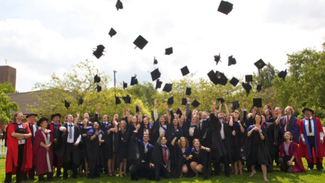 Students celebrate at their graduation ceremony