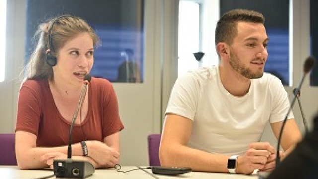 Two Surrey students engaged in a translation exercise