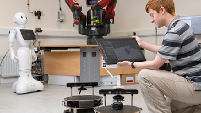 Man working with a robot