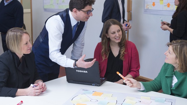 People sat talking at a table