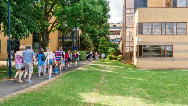 Applicants at an open day walking around campus