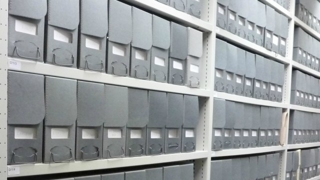 Rows of files in cabinets.