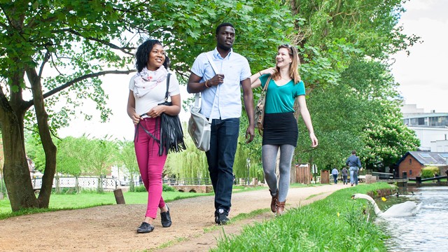 Students walking along the River Wey