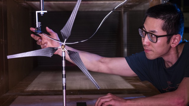 Student using equipment in a wind tunnel