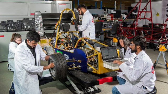 Students working on a race car
