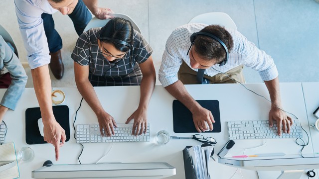 Male pointing at computer screen