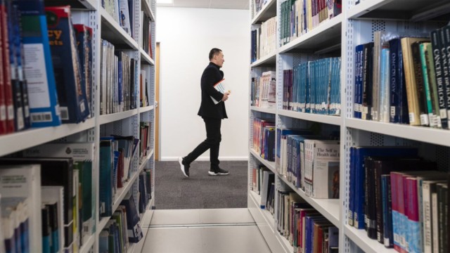 Student walking in library