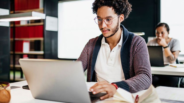 Man sat working on laptop