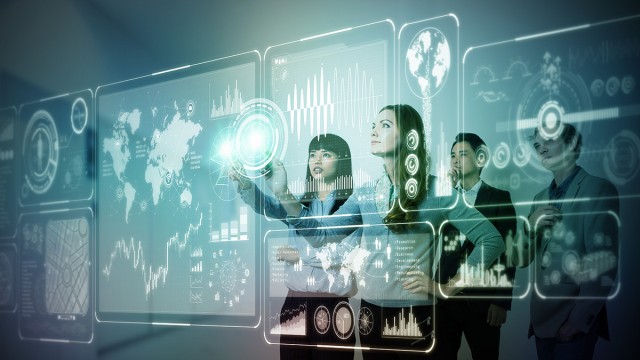 People using digital screen showing data