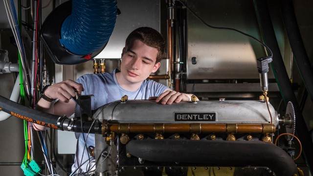 Student working on Bentley engine