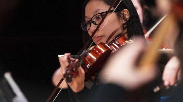 Music student playing violin
