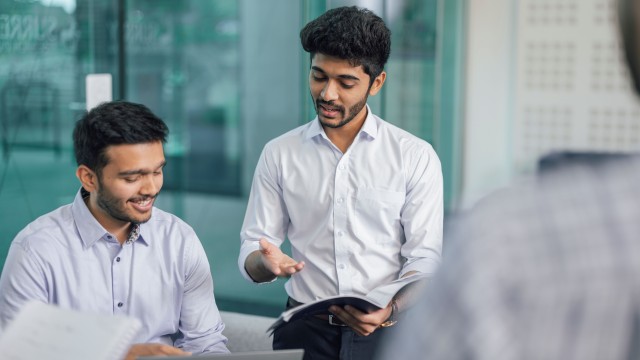 Two people discussing work