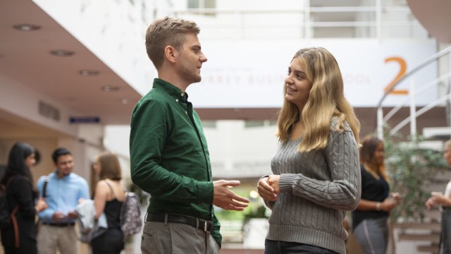 Students chatting as Surrey Business School