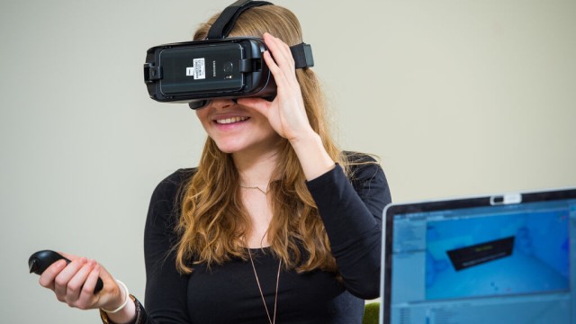 Visor on woman at computer science