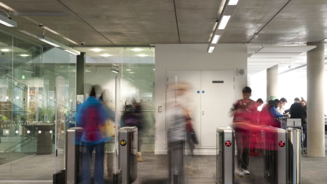 Students in library by entrance rushing 