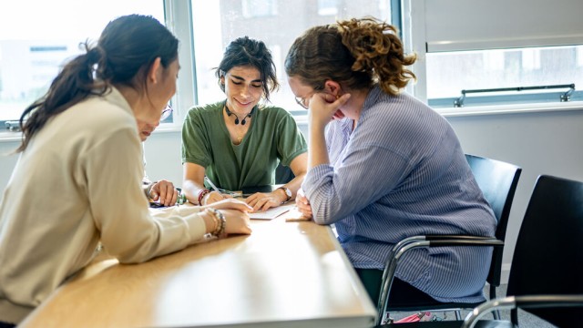 Students collaborating at a table