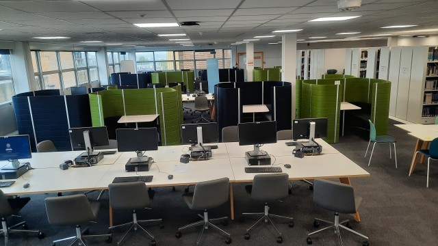 Desks and study pods on level 4 of Library