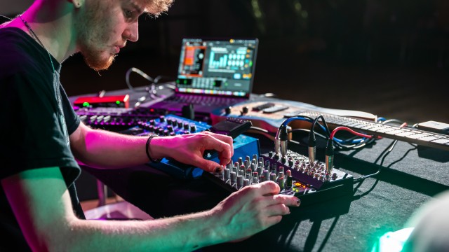 CMT student at a control panel