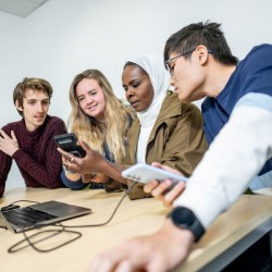 University of Surrey students looking at devices