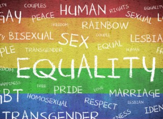 Painting with rainbow background and LGBTQ related words over the top