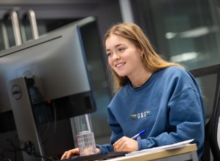 A person using a computer in the new psychology facilities at Surrey