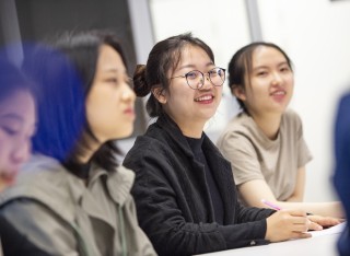 Smiling Chinese interpreting student 