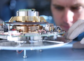Electronic engineering student working on a piece of machinery