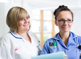 Student nurse with healthcare professional