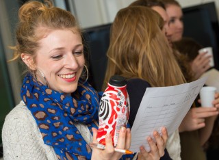 Student holding milkshake bottle