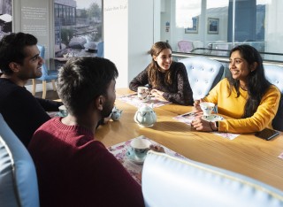 Students chatting around a table