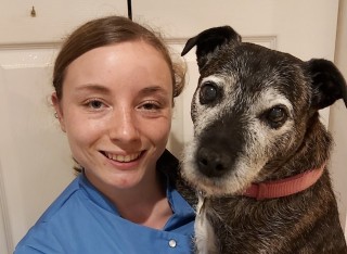 Tamsin Riley holding her pet dog