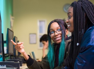 Two girls in computer lab