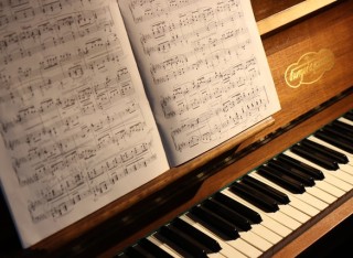 piano with score sheet
