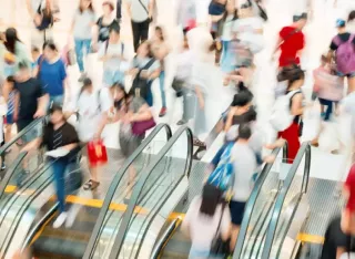 People travelling on escalators