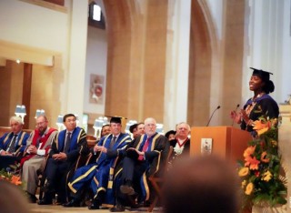 Newly graduated Marie Wiseborn giving speech at Law graduation ceremony in July 2022